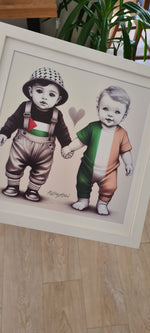 Palestinian and Irish baby holding hands 🇮🇪❤️🇵🇸