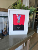 Framed Marathon Medal Over City Skyline