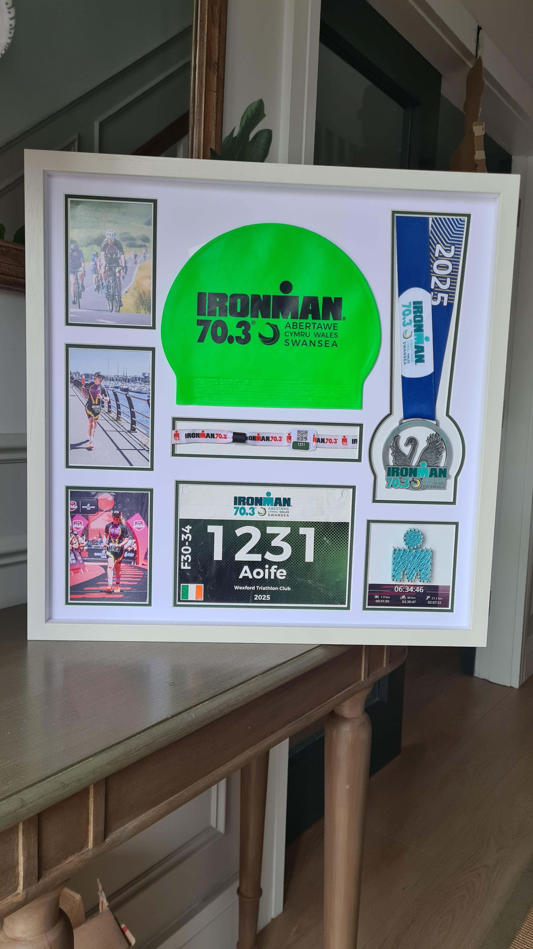 Iron-man Frame including medal, hat, race number and wrist band.