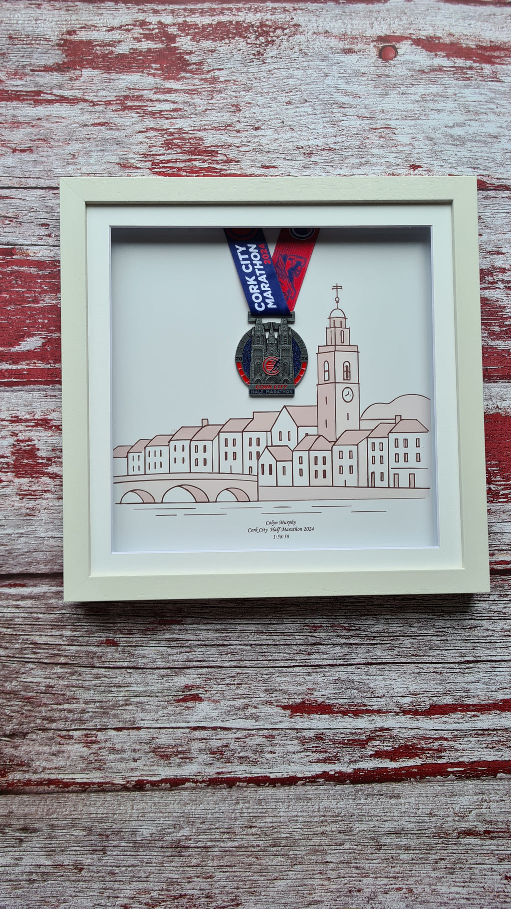Framed Marathon Medal Over Skyline Drawing of Cork City