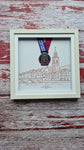 Framed Marathon Medal Over Skyline Drawing of Cork City