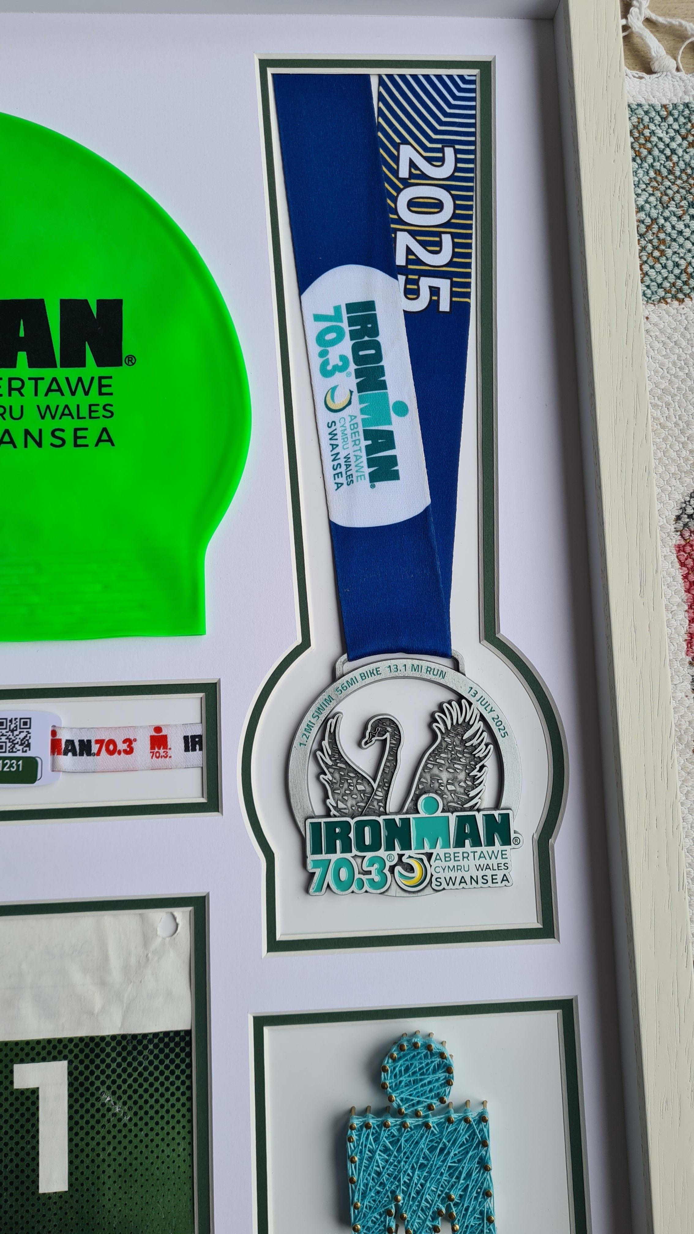 Iron-man Frame including medal, hat, race number and wrist band.