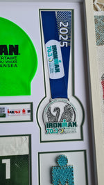 Iron-man Frame including medal, hat, race number and wrist band.