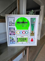 Iron-man Frame including medal, hat, race number and wrist band.