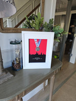 Framed Marathon Medal Over City Skyline