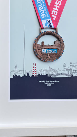 Framed Dublin Marathon Medal over skyline of Dublin City