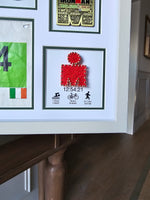 Iron-man Frame including medal, hat, race number and wrist band.